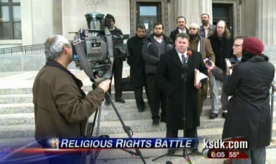 Naeem and his attorneys speaking to the press. - via
