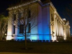 The Missouri History Museum shines in blue.