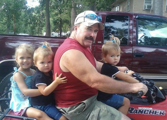 Pat Bray and his granddaughters. - Courtesy of Bray family