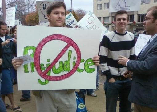 Burns (holding sign), O'Keefe (striped shirt) and Basel (in the suit) infiltrated a St. Louis gay-rights rally last fall. - stlactivisthub.blogspot.com