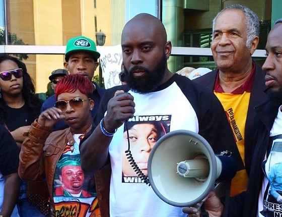 Lesley McSpadden and Michael Brown Sr. outside the Buzz Westfall Justice Center in Clayton. - JESSICA LUSSENHOP