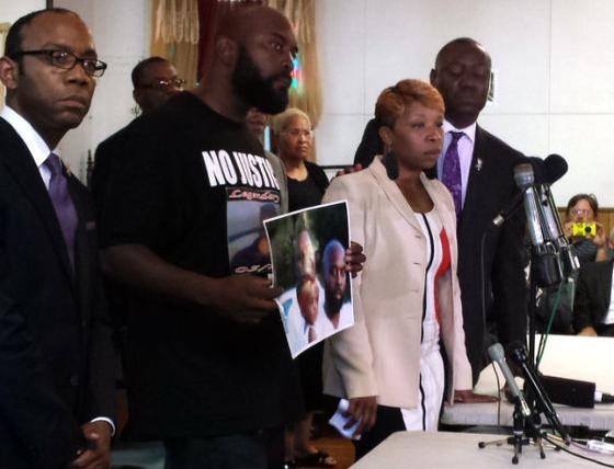 The parents of Michael Brown (center) with attorney Benjamin Crump (right) at a news conference last week. - Jessica Lussenhop