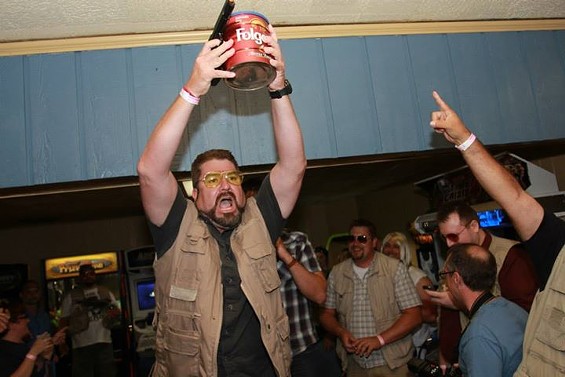 Marcus Bautista looks amazingly like Walter Sobchak from The Big Lebowski -- especially with a can of ashes and a gun. - PHOTOS COURTESY OF MARCUS BAUTISTA