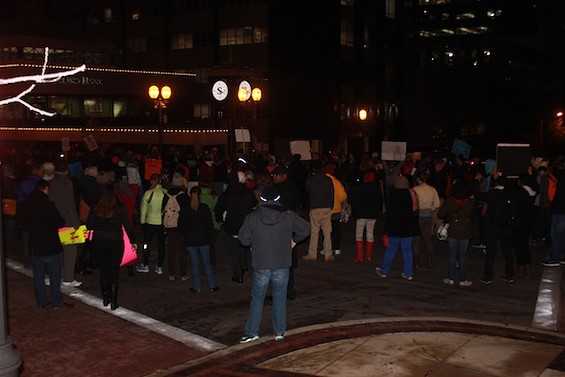 Protesters in Clayton prepare for four and a half minutes of silence in honor of Mike Brown. - Mitch Ryals