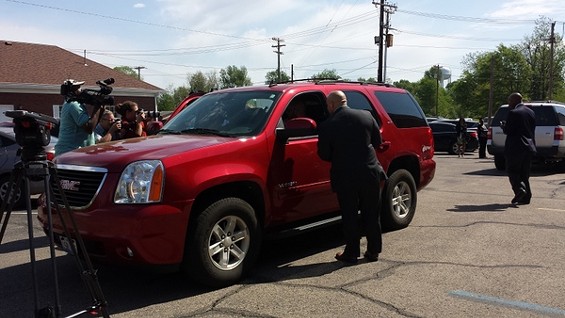 Mike Anderson and his family drive away from jail (and reporters). - Jessica Lussenhop