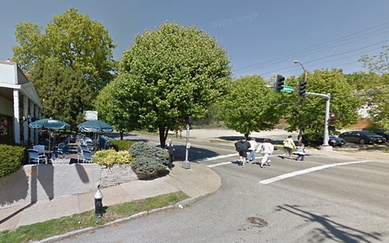 Pedestrians cross where a woman was struck and killed by two cars in front of Olympia Kebob House and Taverna. - Google Maps