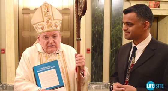 Cardinal Raymond Burke (with the staff) has a problem with women-filled churches and gay clergy. - via YouTube