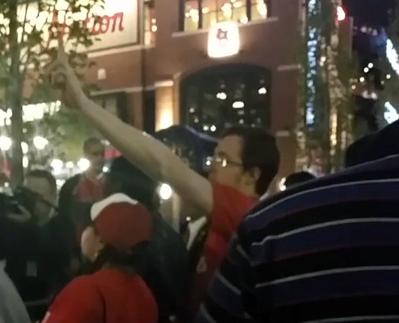 At least one Cardinals fan held up a peace sign to Michael Brown protesters. - COURTESY DANIEL SUAREZ