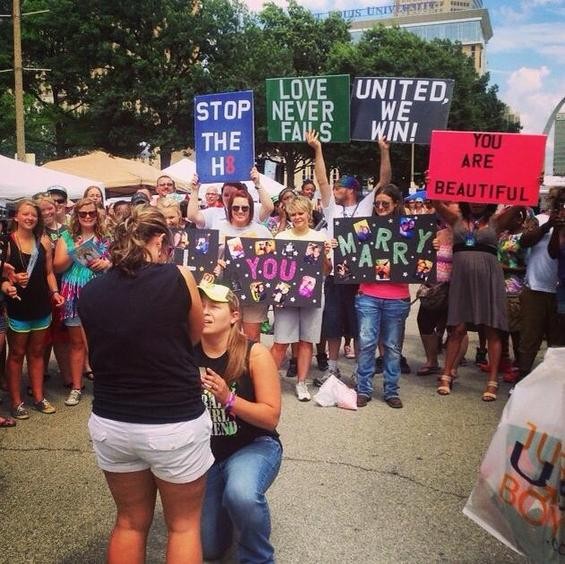 A couple getting engaged at this year's PrideFest. - RFT Street Team