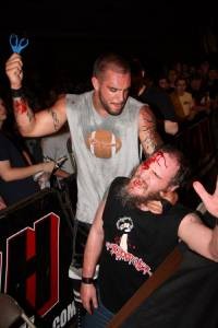 Necro Butcher puts in a hard day's work taking scissors to the skull. - Courtesy of Ring of Honor