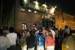 Thrill seekers gather outside The Darkness in October 2008.