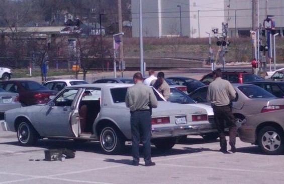 St. Louis County police investigate a primer gray Chevrolet Impala involved in shooting. - Amir Kurtovic