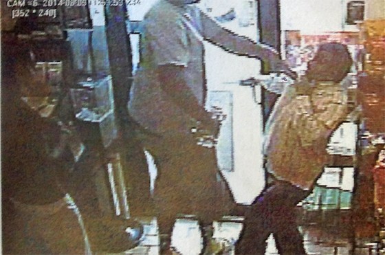 Ferguson police say this image shows Michael Brown roughing up a convenience-store owner just prior to an officer shooting the suspect.