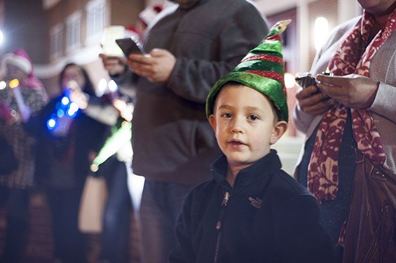 Liam Maupin helps spread the Christmas cheer in front of the Ferguson Fire Station on South Florissant Road. - All photos by Kelly Glueck