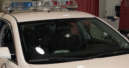 The police cruiser bears two bullet holes in the windshield. - Photo: St. Louis Metropolitan Police Department