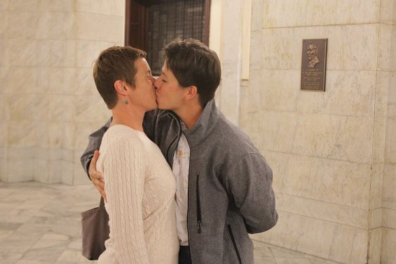 Crystal Peairs and April Breeden kiss after marrying in the St. Louis City Hall rotunda Wednesday. - Danny Wicentowski