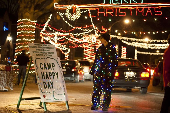 Missey Doll of St. Louis functions as traffic control director and decoration on Candy Cane Lane. - KHOLOOD EID