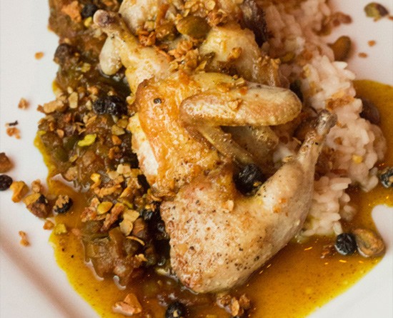Juniper's "Country Captain": curry-glazed quail, Carolina-gold rice, currant stew and pistachio granola. | Photos by Mabel Suen