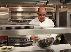 Chef David Zimmerman preparing hollandaise in the Plush kitchen. - Mabel Suen