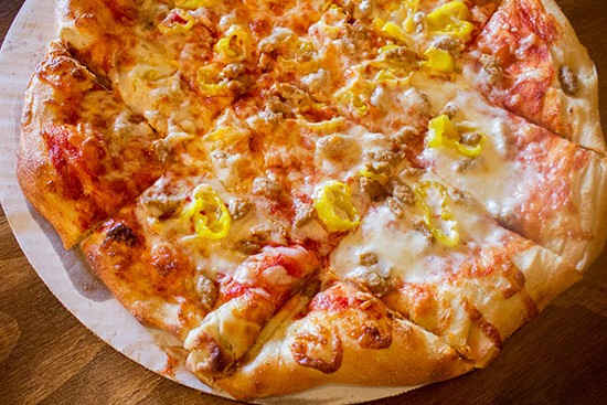 Hand-tossed sausage and banana pepper pizza.