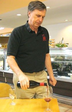 Bud Starr of Starr Wines measures us a glass of Parker Station pinot noir. - Erika Miller