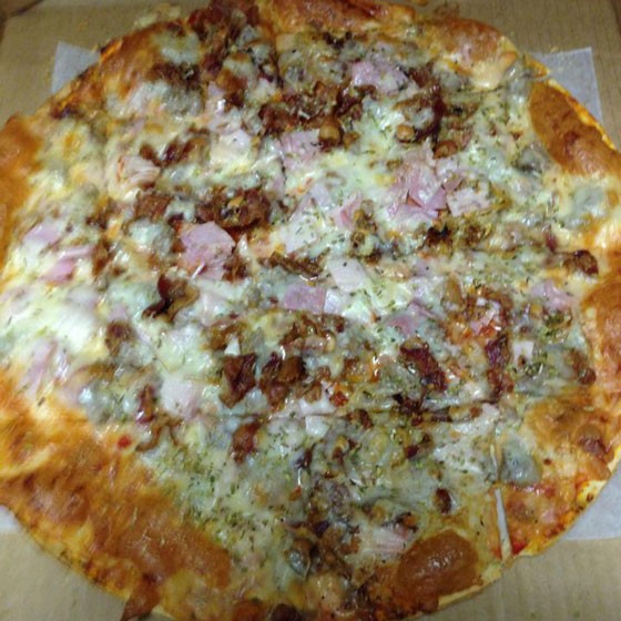 The "Hog Heaven" pizza topped with pulled pork, bacon, Italian sausage and ham. | Kevin Guerra