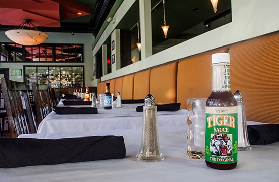 A different kind of hot sauce for every table.