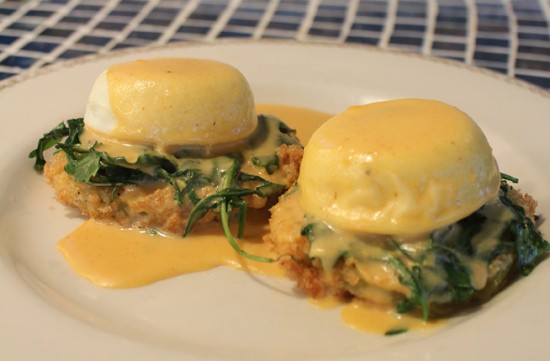Eggs benedict served atop fried green tomatoes at Plush - Mabel Suen