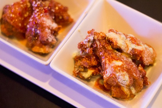Try some of Felix's chicken wings smothered in various sauces while you wait.