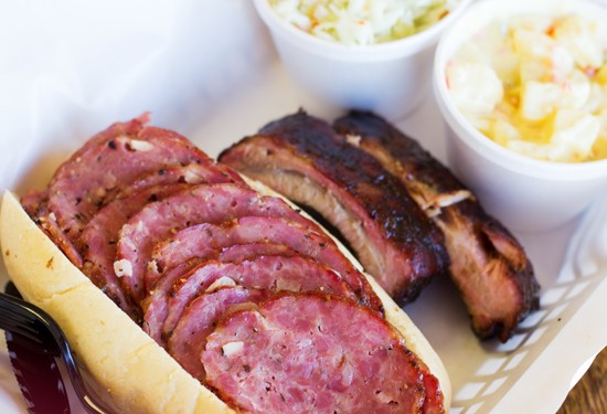A smoked salami sandwich with a sampling of ribs, potato salad and coleslaw. - Mabel Suen
