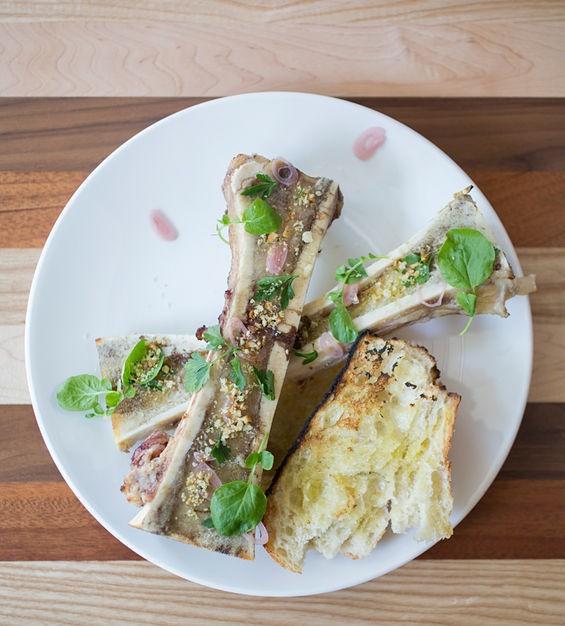 Decadent bone marrow with grilled bread, watercress and shallots. - Jennifer Silverberg