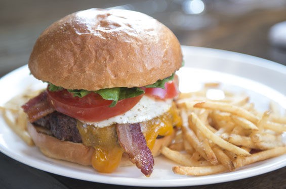 Element's hamburger is served on a brioche bun with cheddar, bacon and egg. - Corey Woodruff