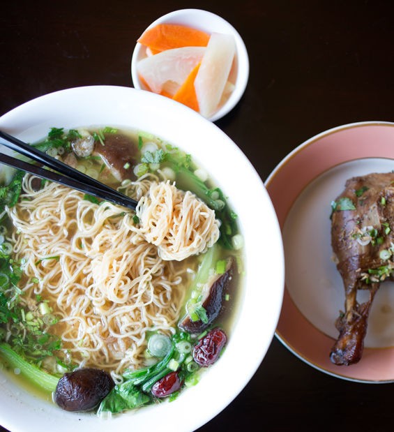 Mi vit tiem, the five-herb duck, is slow-cooked and served over egg noodles and baby bok choy. - Jennifer Silverberg