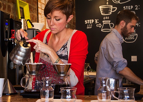 Co-owner Jessie Mueller prepares coffee with a kalita wave dripper. - Mabel Suen