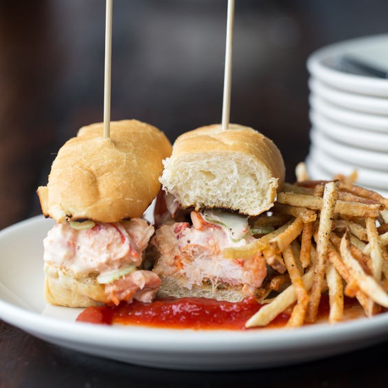 The lobster roll comes with white truffle mayo, shaved celery, matchstick fries and tomato jam. - Jennifer Silverberg