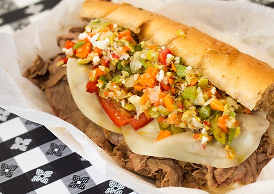 Italian beef sandwich with thinly sliced beef, cheese, peppers and onions topped with giardiniera. | Photos by Mabel Suen
