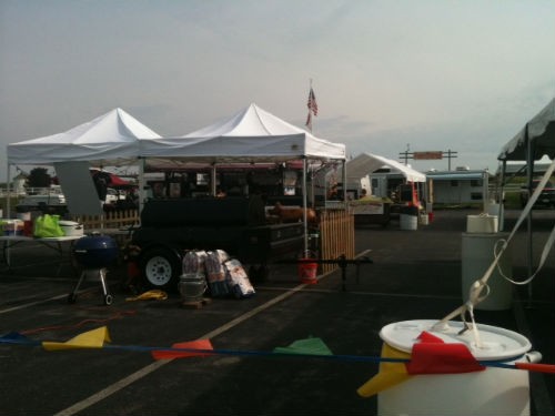 Barbecue competitors set up for Eckert's DadFest. - Robin Wheeler