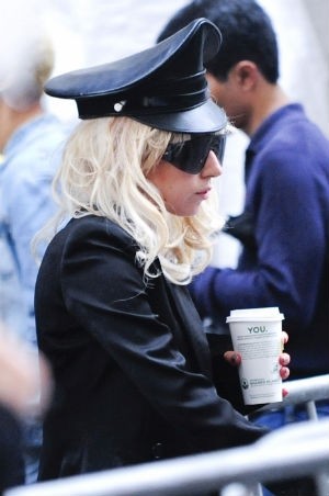 Lady Gaga, on the edge of a glorious Venti latte. - buzznet.com