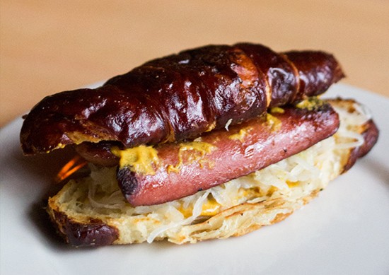 The "Alsatian Dawg," a Nathan's hot dog on a pretzel croissant with sauerkraut and spicy mustard.