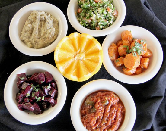 An assortment of Mediterranean salads and dips, including Harir's tabbouleh - Kelly Hogan