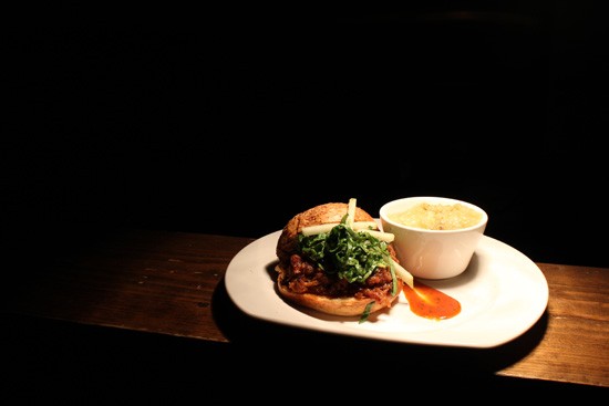 Chef Jimmy Hippchen's pulled-pork sandwich with cilantro barbecue sauce. - Mabel Suen