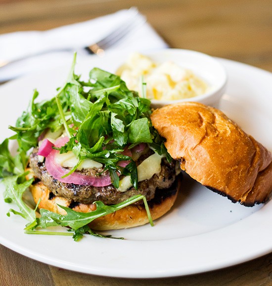 The "House Burger," a Rain Crow ground-beef short-rib burger with aged white cheddar and pickled onions. | Photos by Mabel Suen