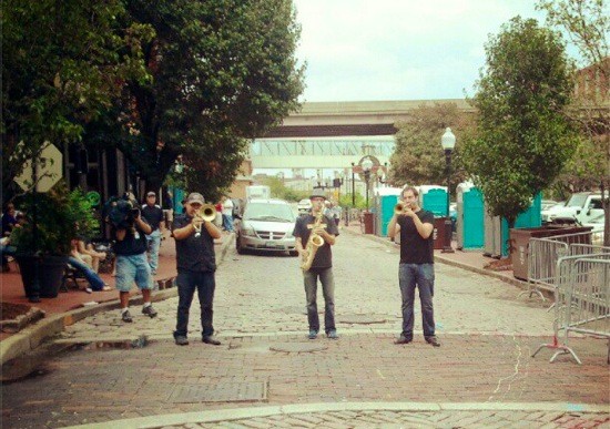 A horn section (the Blue City All-Stars?) plays on Second Street on Saturday afternoon.