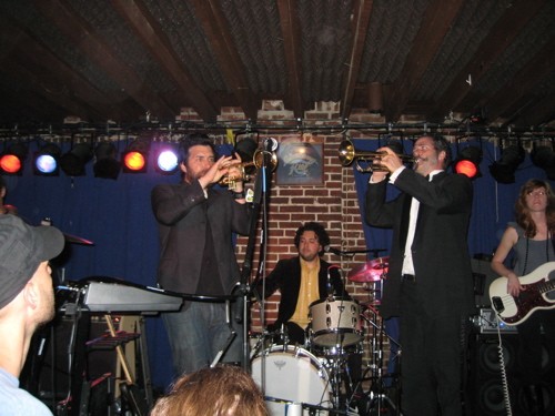 Bob Schneider (left) at the Duck Room, June 9, 2009, with Ollie Steck (trumpet), Conrad Choucroun (drums) and Harmoni Kelley (bass) - Ken Stoner