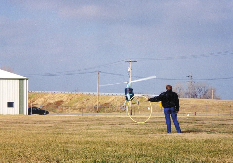 Barklage performed aerial stunts in his Mini 500 helicopter. In this photo, he's practicing snatching a hula hoop with the craft's landing gear. - COURTESY OF GENE HOFFMEYER