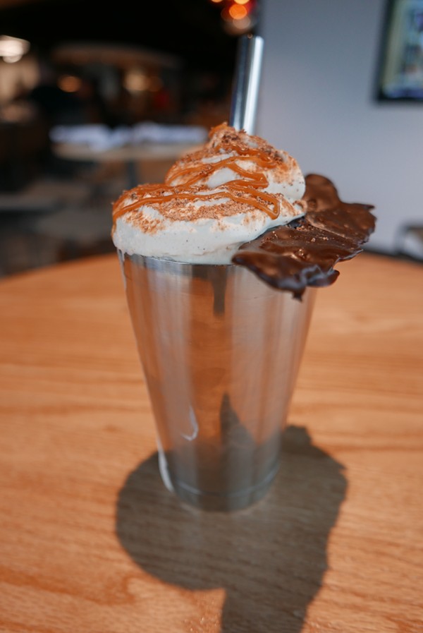 The "Chocolate Pig Shake" comes complete with chocolate-covered bacon, combining the two restaurant specialties in one bite. - DESI ISAACSON