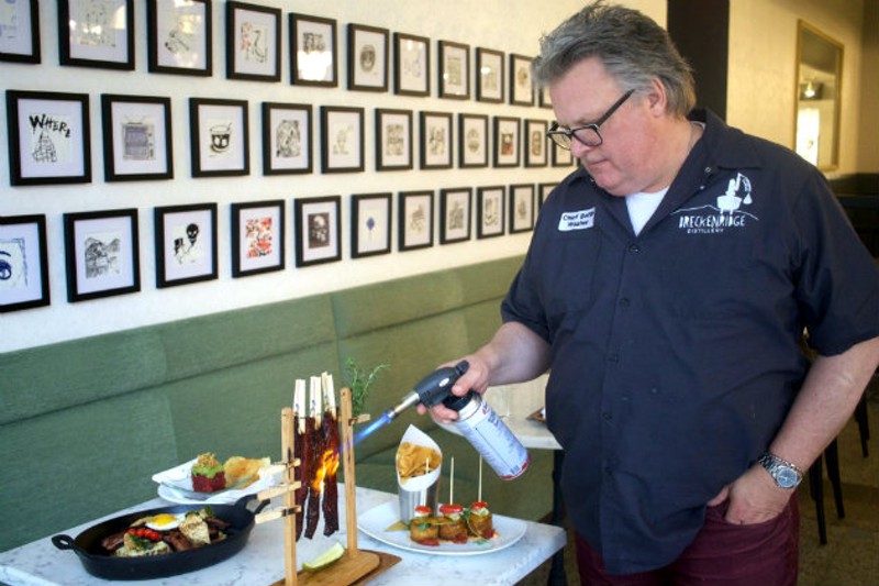 Acclaimed Chef David Burke torches the "Clothesline Bacon"' tableside. - CHERYL BAEHR