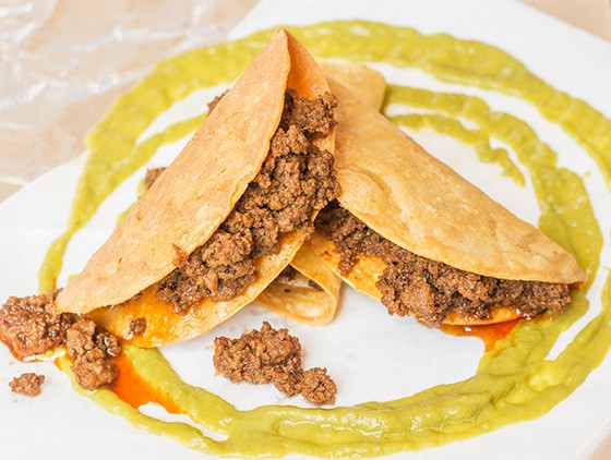 Three ground-beef tacos in crispy tortilla shells. - Mabel Suen