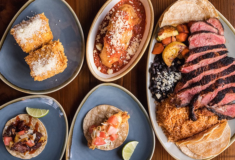 Barrio’s menu features Latin American-inspired cuisine, including street corn, a chile relleno, a ribeye, a fish taco and a pork taco. - MABEL SUEN