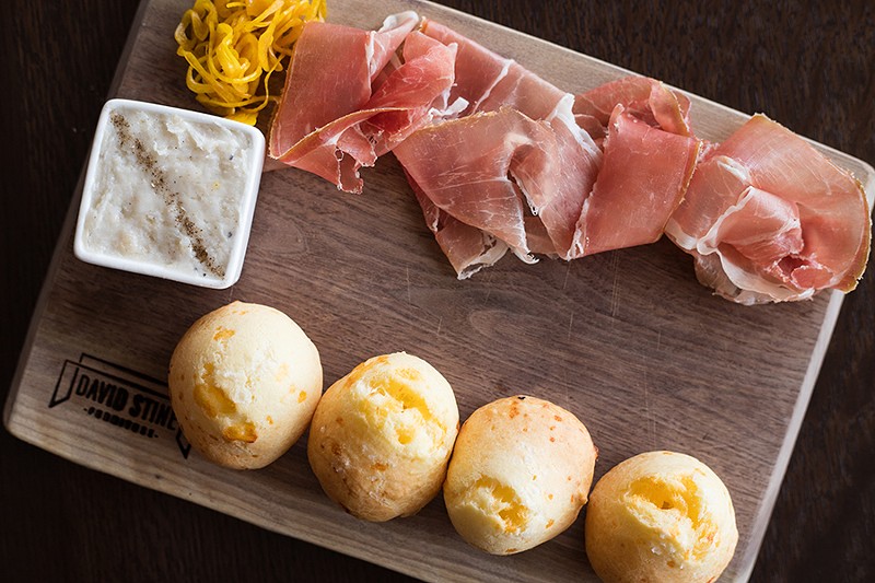 ”Dia’s Cheese Bread,” with country ham, smoked lardo and pickled vegetables, is named after the woman who inspired the restaurant. - MABEL SUEN